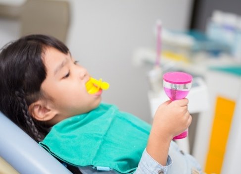 Child receiving fluoride treatment