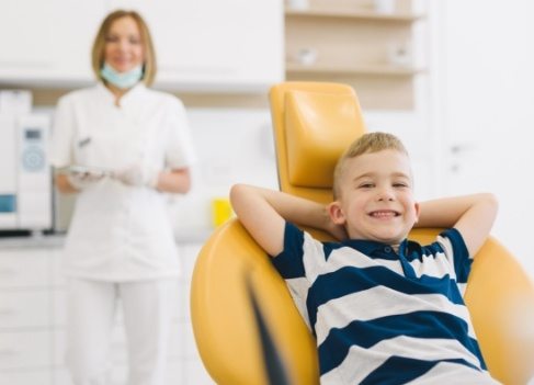 Child sharing healthy smile after silver diamine fluoride treatment