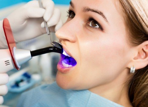 Dental patient receiving cosmetic dental bonding