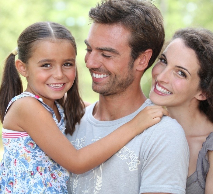 Family smiling after visiting their orthodontist in Anaheim