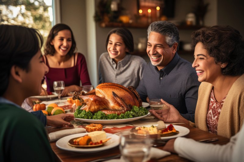 a family smiling together during Thanksgiving 